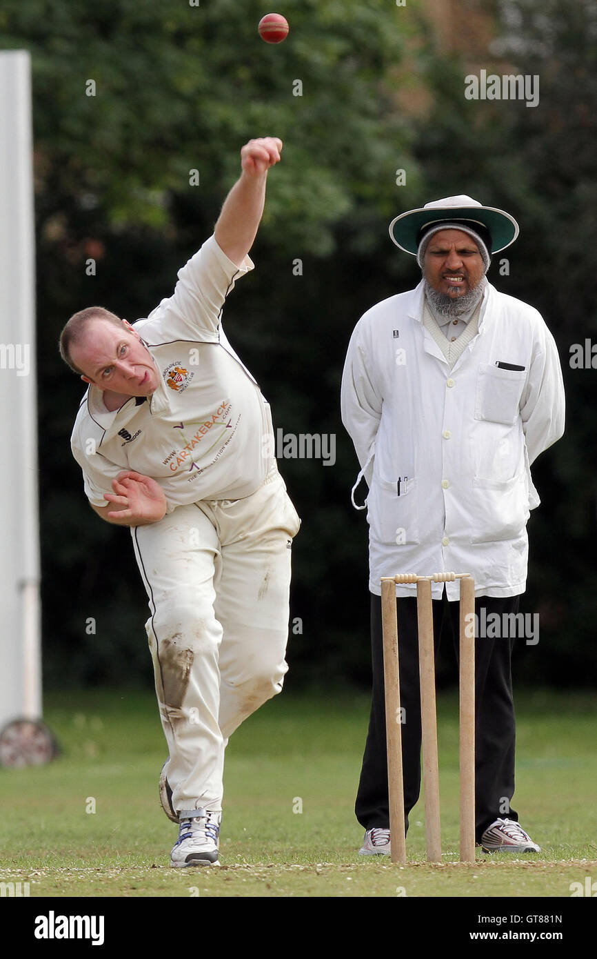 P Crane in bowling action for Hornchurch Athletic - Hornchurch Athletic CC (fielding) vs Barking CC - Essex Cricket League - 09/07/11 - contact@tgsphoto.co.uk Stock Photo