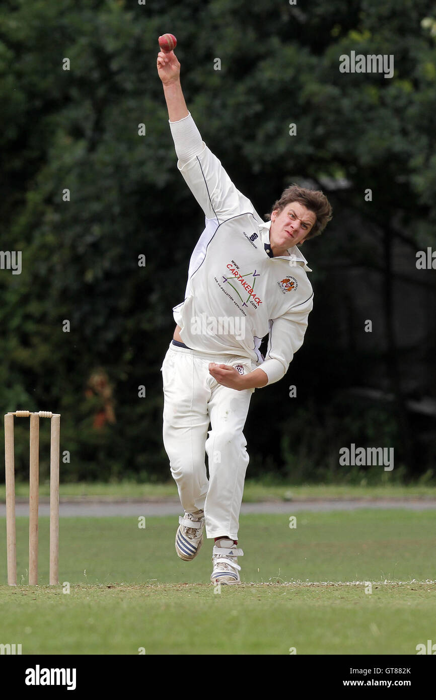 J Coote in bowling action for Hornchurch Athletic - Hornchurch Athletic CC (fielding) vs Barking CC - Essex Cricket League - 09/07/11 - contact@tgsphoto.co.uk Stock Photo
