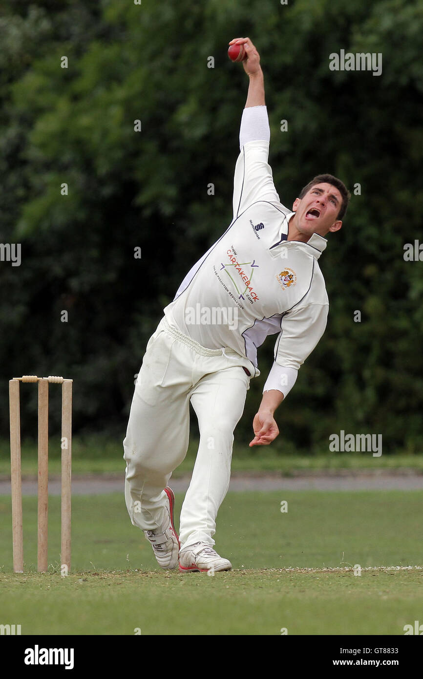 S Caruana in bowling action for Hornchurch Athletic - Hornchurch Athletic CC (fielding) vs Barking CC - Essex Cricket League - 09/07/11 - contact@tgsphoto.co.uk Stock Photo