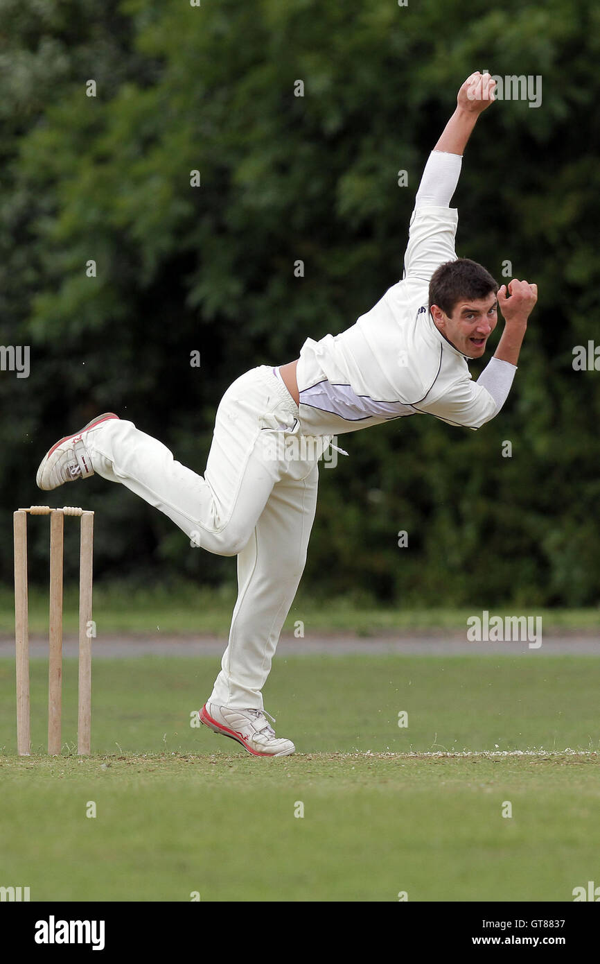 S Caruana in bowling action for Hornchurch Athletic - Hornchurch Athletic CC (fielding) vs Barking CC - Essex Cricket League - 09/07/11 - contact@tgsphoto.co.uk Stock Photo