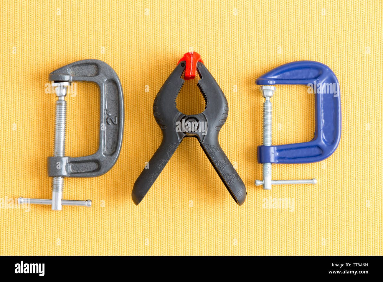 Assorted clamps from Dad's tool kit with adjustable grey and blue G