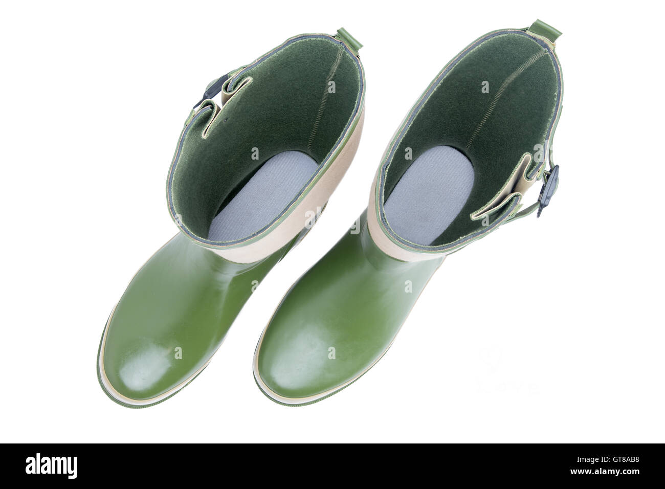 Overhead view looking inside a pair of green garden boots down to the inner sole standing side by side isolated on white backgro Stock Photo