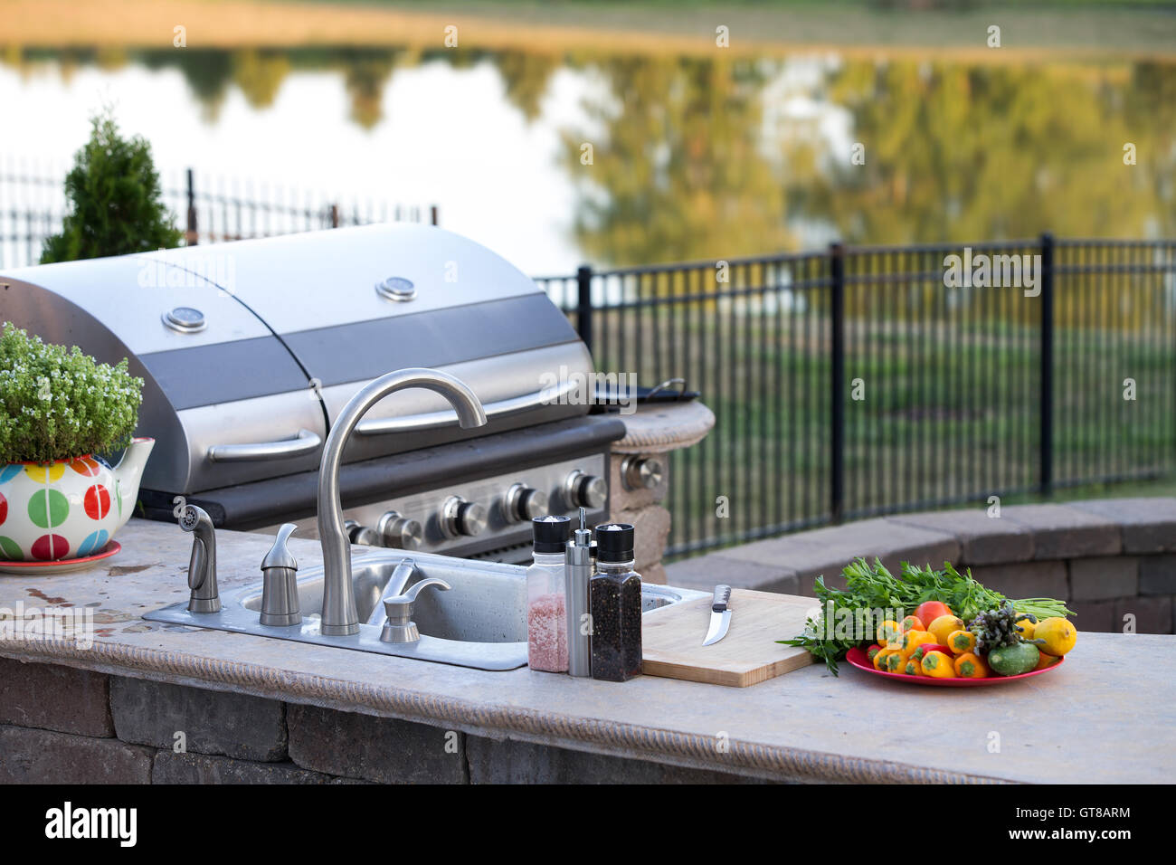 Preparing a healthy summer meal in an outdoor kitchen with gas barbecue