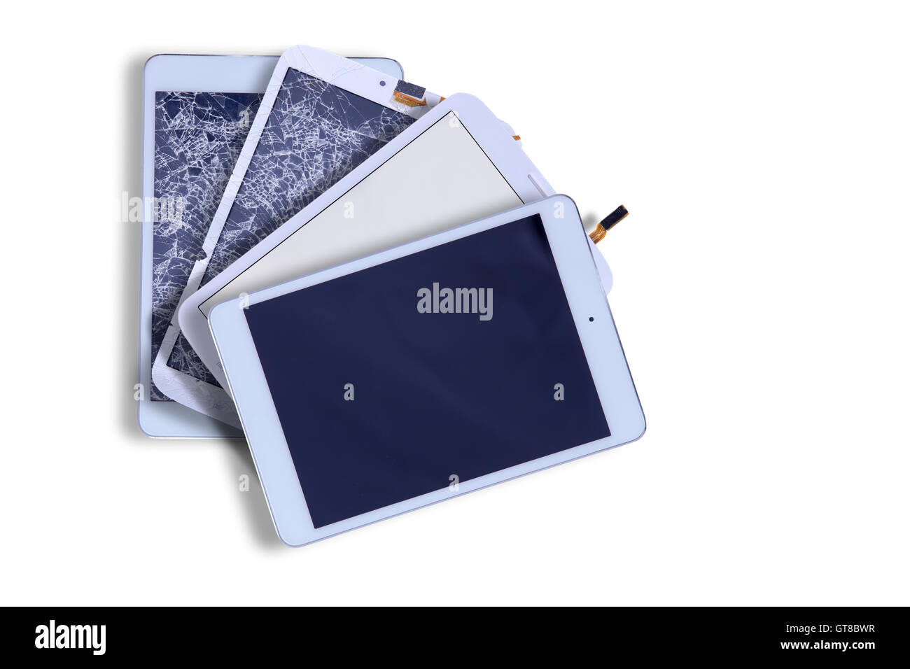 Fanned arrangement of four tablets with blank screens showing two with