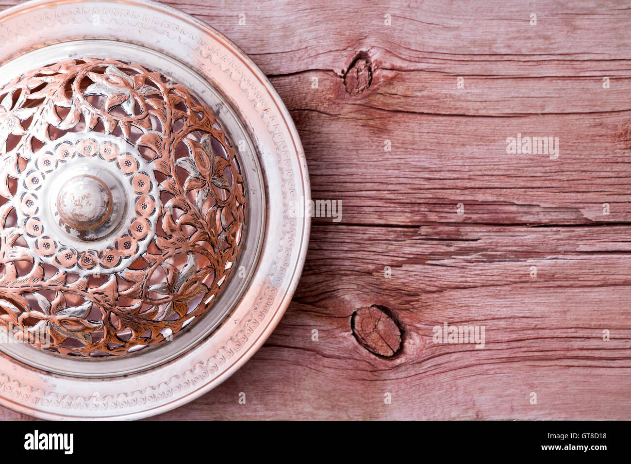 PLEATED BACK TRENCH ORNATE ON A PLATE