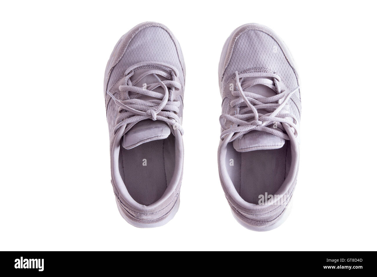 High Angle View of Pair of Worn White Sneakers or Running Shoes with Tied Laces on White Background Stock Photo