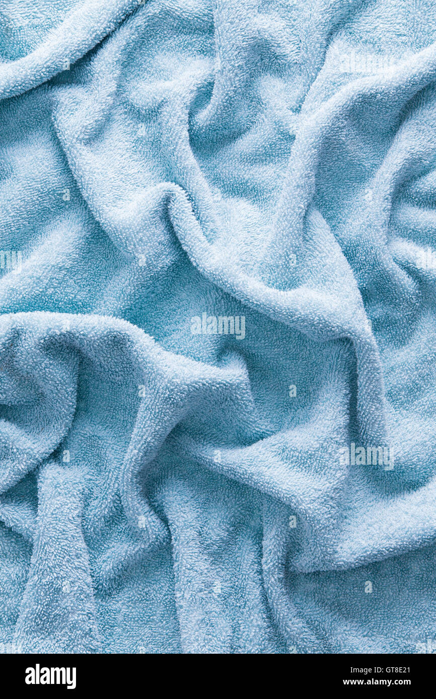 Close up Light Blue Textured Soft Cotton Unfolded Bath Towel for Backgrounds Stock Photo