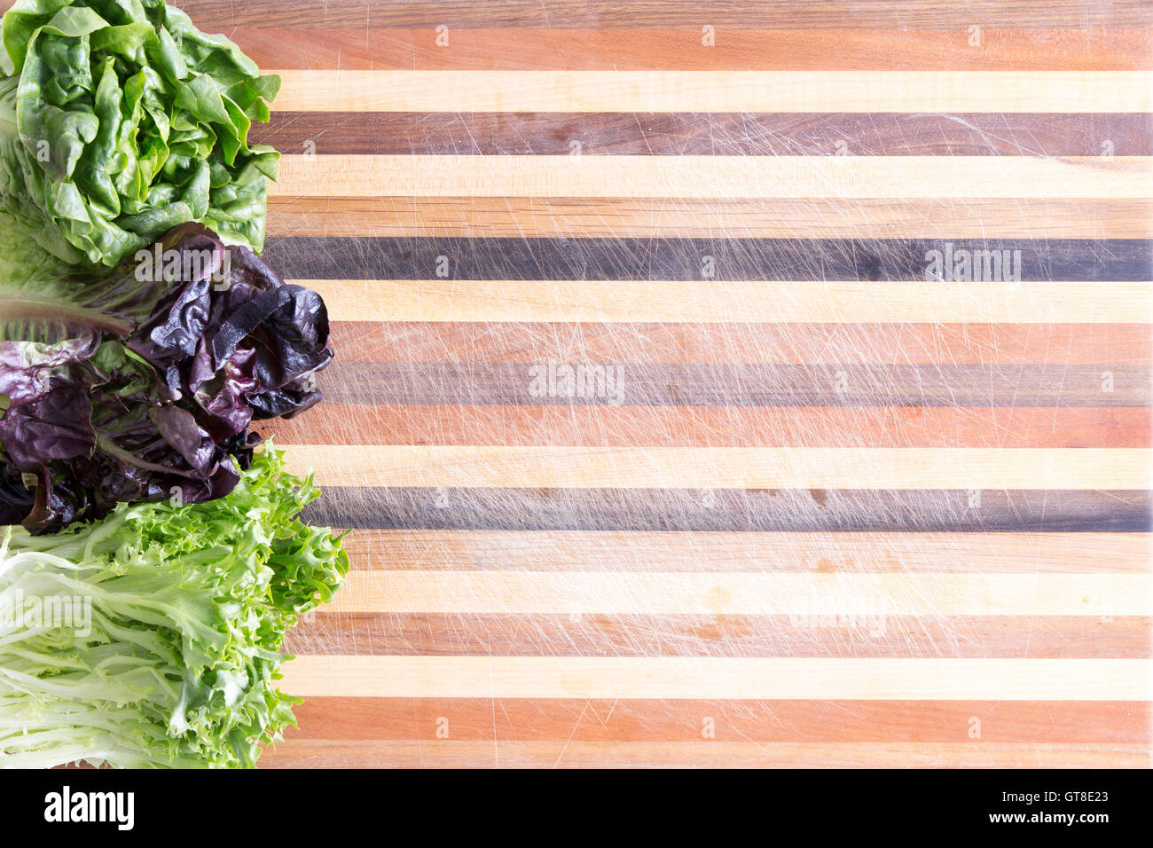 Fresh Lettuce Border With Three Cultivars On A Decorative Laminated 