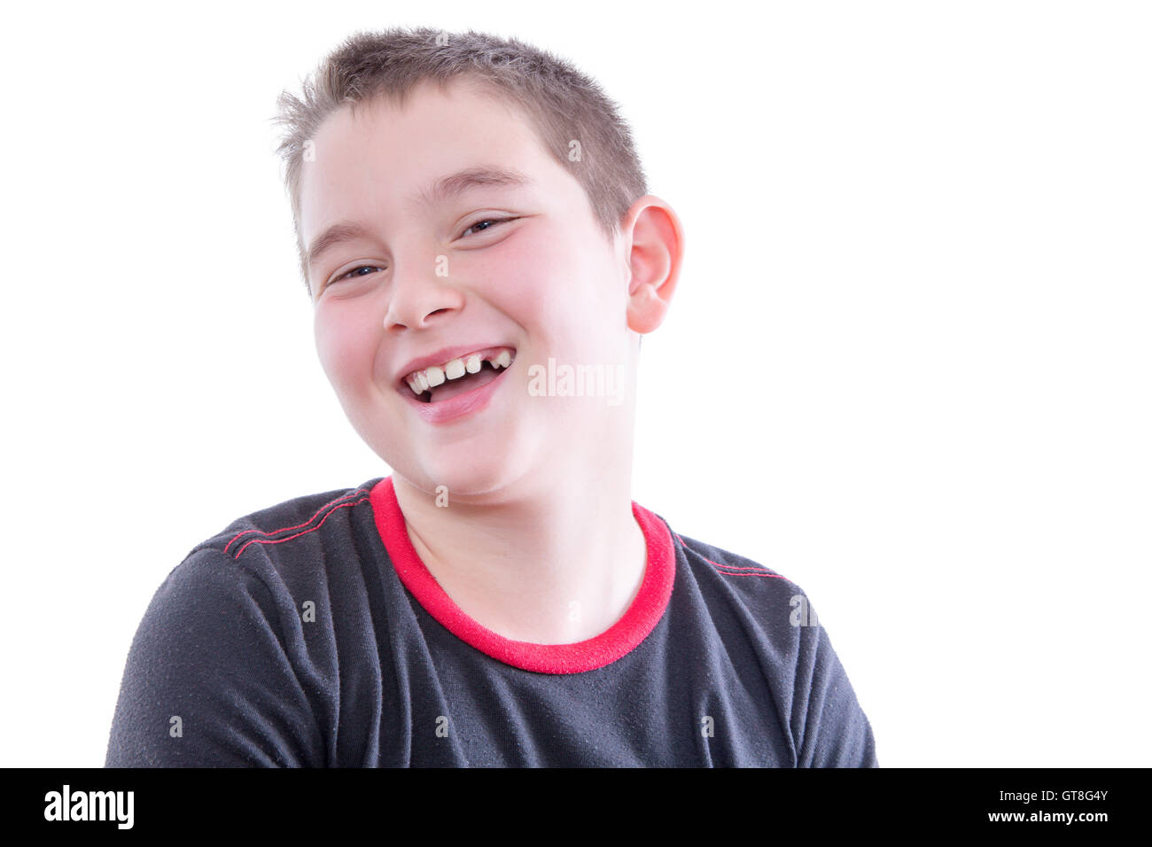Head and Shoulders Close Up Portrait of Young Boy Wearing Black and Red Shirt Laughing and Showing Braces in Bright Studio with Stock Photo