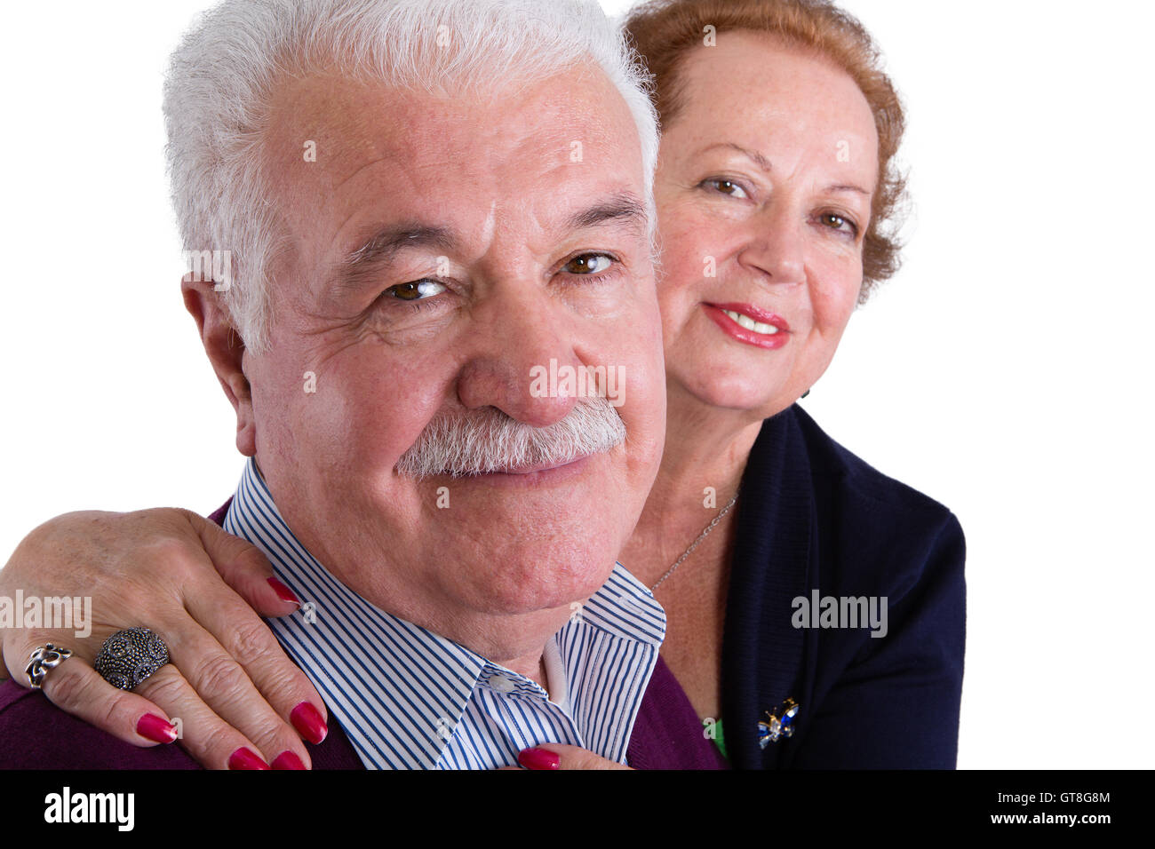 Close up Happy Senior Business Couple Smiling at the Camera Against White Background. Stock Photo