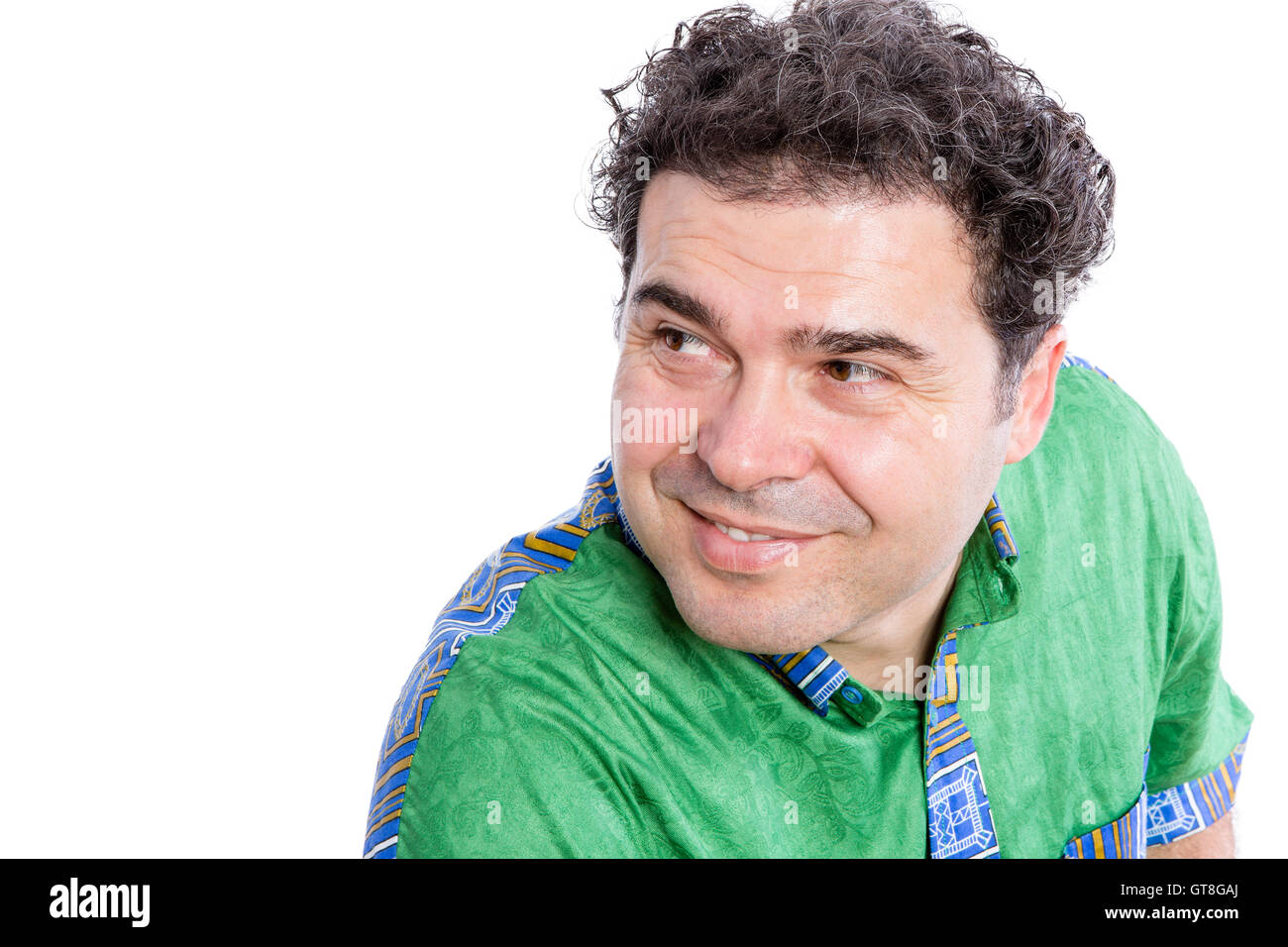 Close up Middle Aged Man Wearing African Shirt, Looking Sideways with Smiling Face Against White Background. Stock Photo