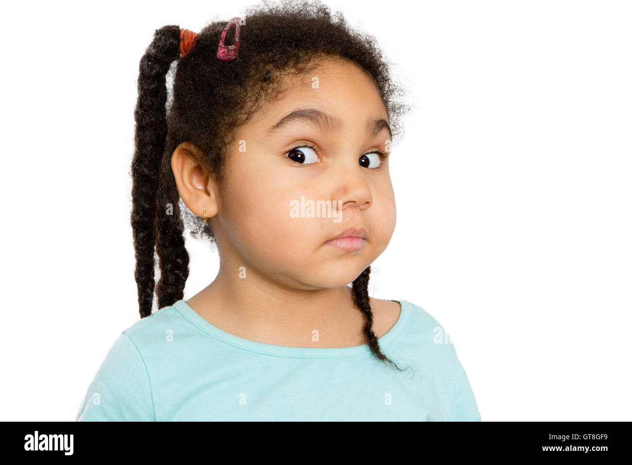 Close up Cute Young Girl Showing Surprised Facial Expression Against White Background Stock Photo