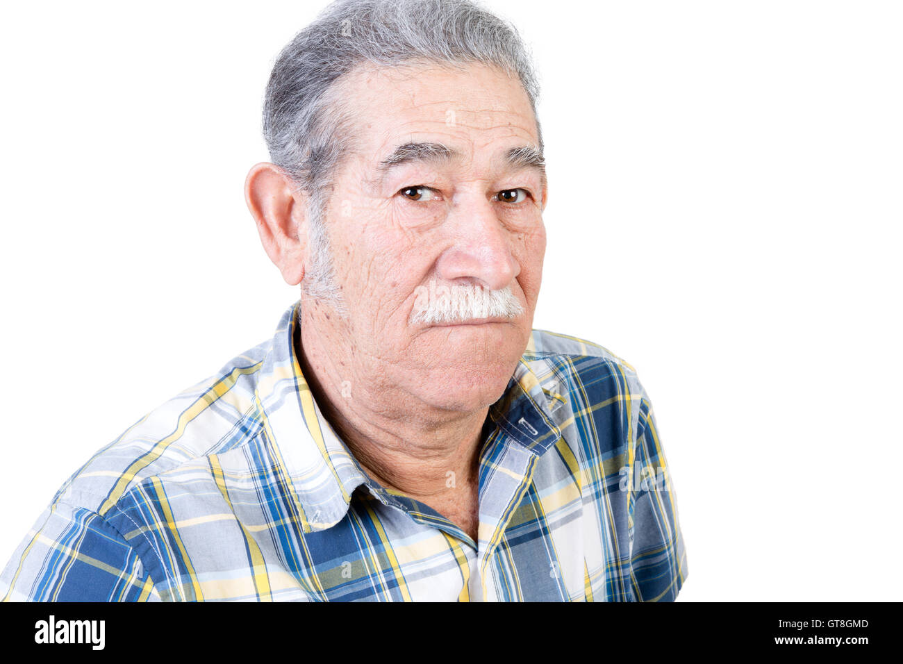 One serious mature male with mustache wearing blue and yellow striped flannel shirt over white background Stock Photo