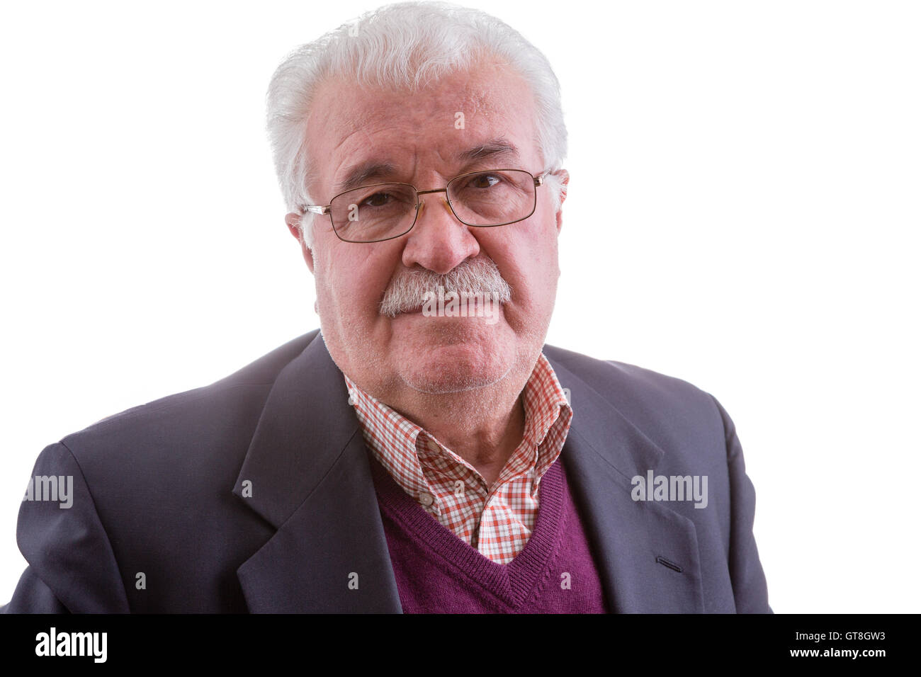 Retired senior man with a troubled contemplative expression gazing directly at the camera, head and shoulders isolated on white Stock Photo