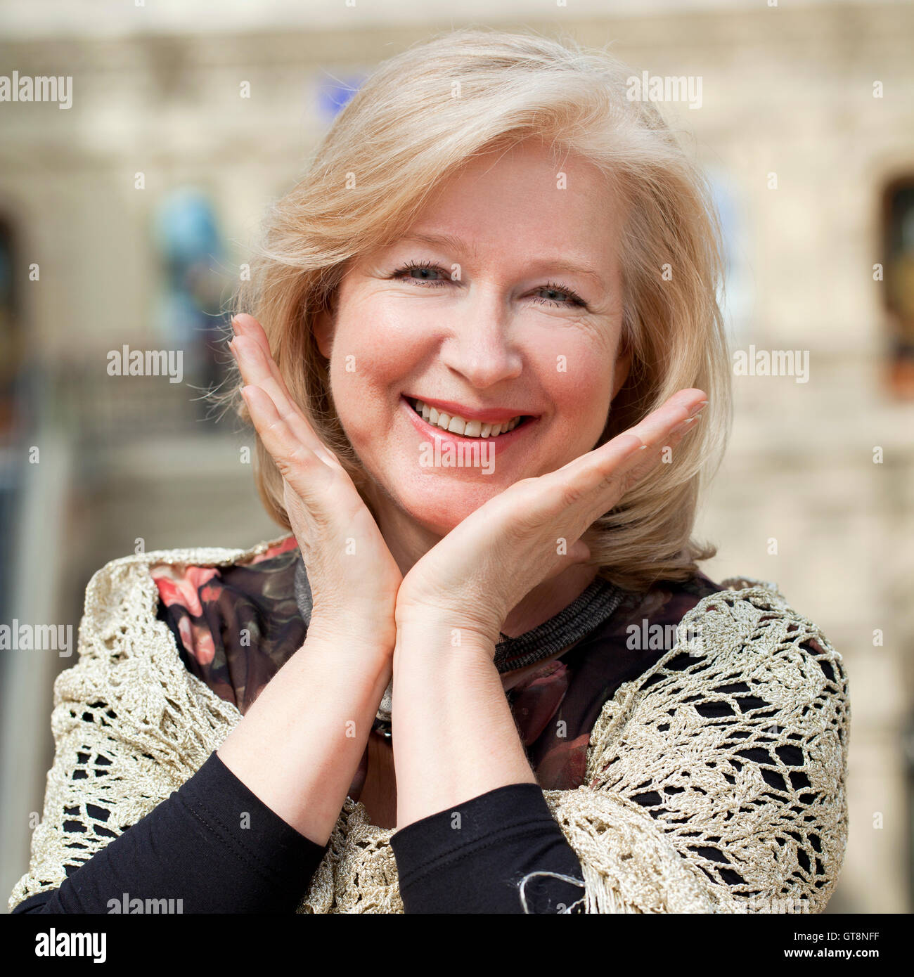 Close up facial portrait of a beautiful senior woman looking at the ...