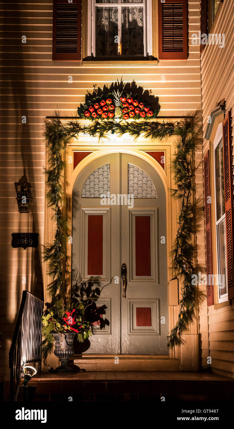 Vintage winter Victorian house front door colour at night with ...