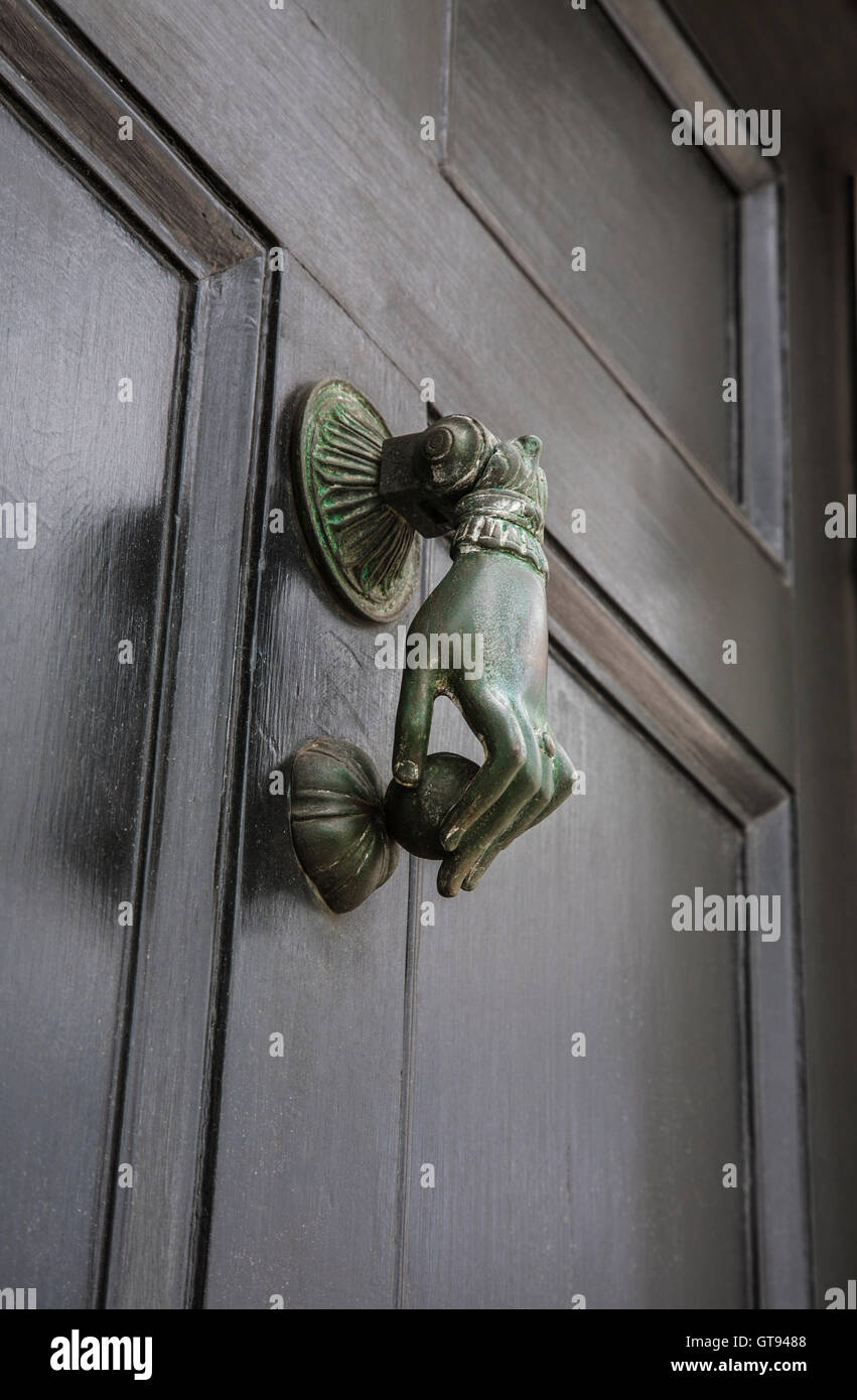 Close up Victorian brass front door knocker hardware ladies hand on a black  front door, door knockers, historic Charleston, South Carolina, USA, US PT  Stock Photo - Alamy