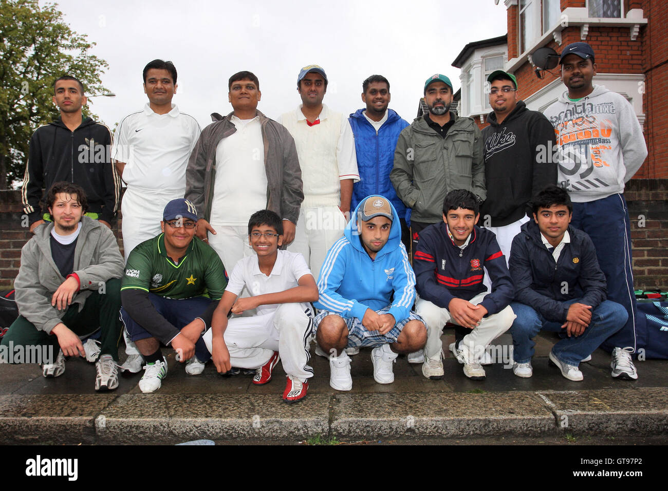 Members of Ilford CC 2nd, 3rd and 4th XIs wait in the rain for a lift to their match - Essex Cricket League - 16/07/11 - contact@tgsphoto.co.uk Stock Photo