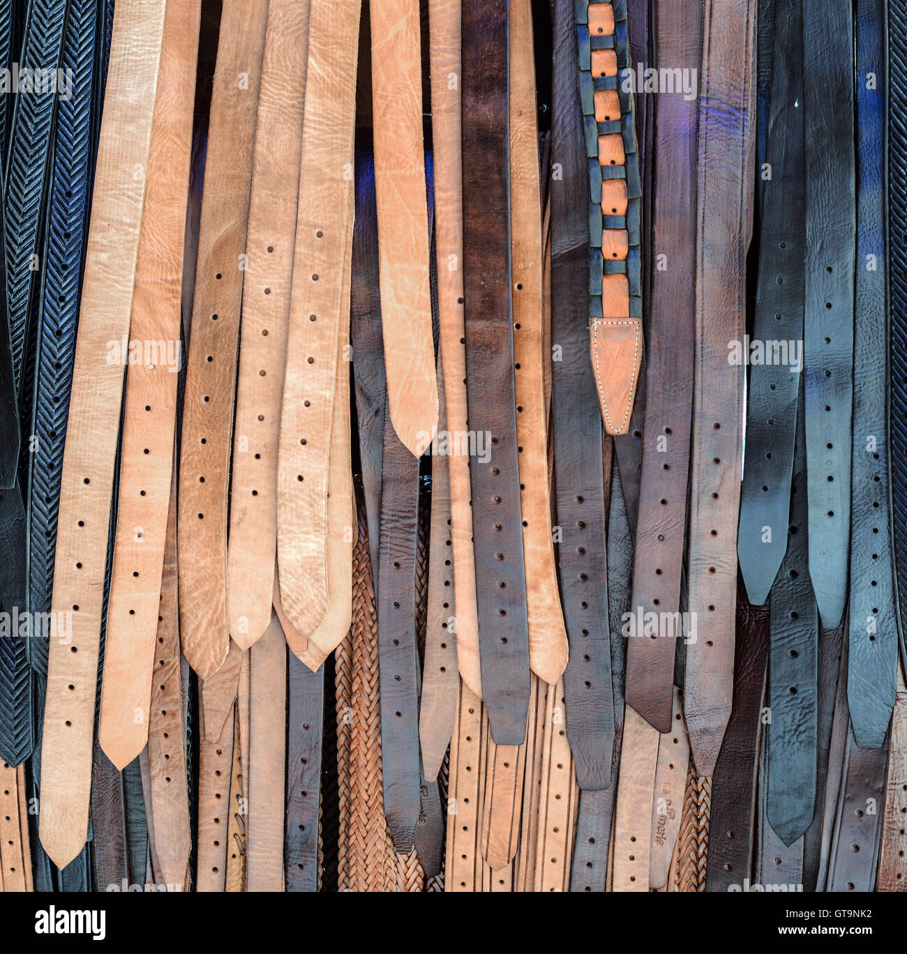 Pile of leather belts hanging Stock Photo Alamy