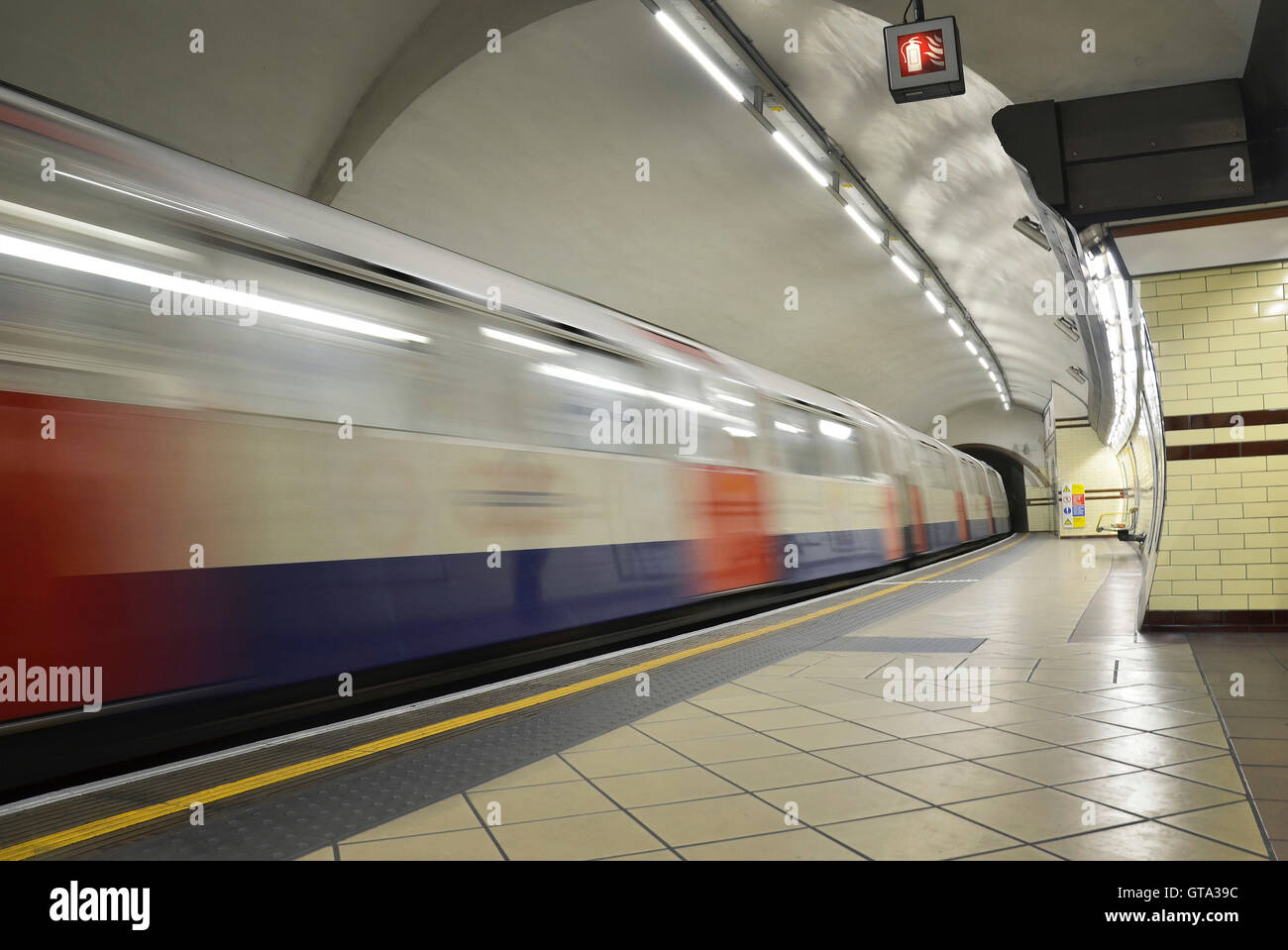 View of London Underground Platform at Edgware Road with Train Leaving, London, England, UK Stock Photo