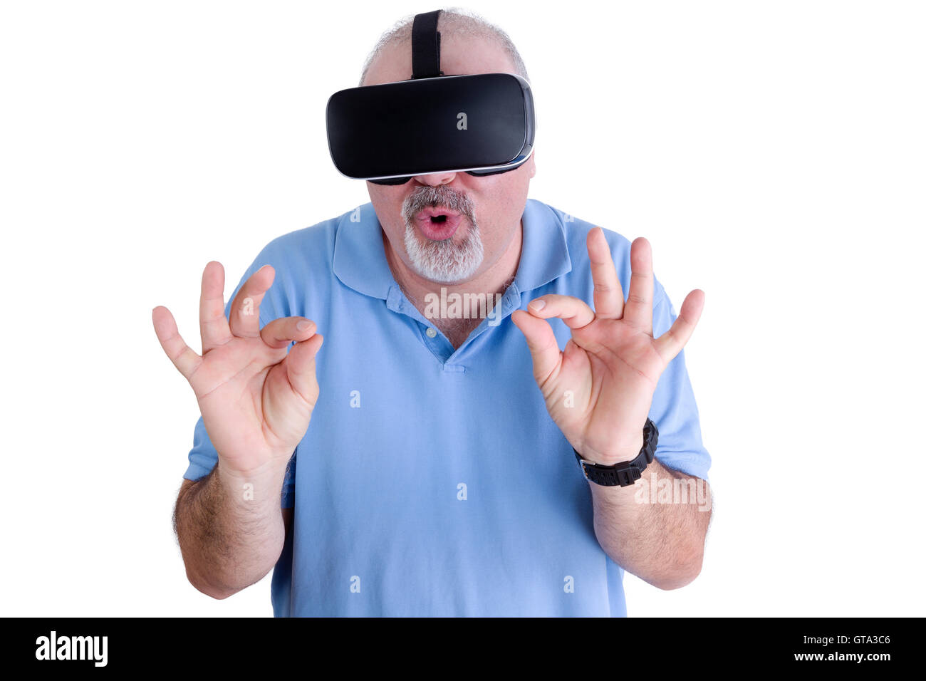 Man on white background wearing virtual reality glasses rounds his lips ...