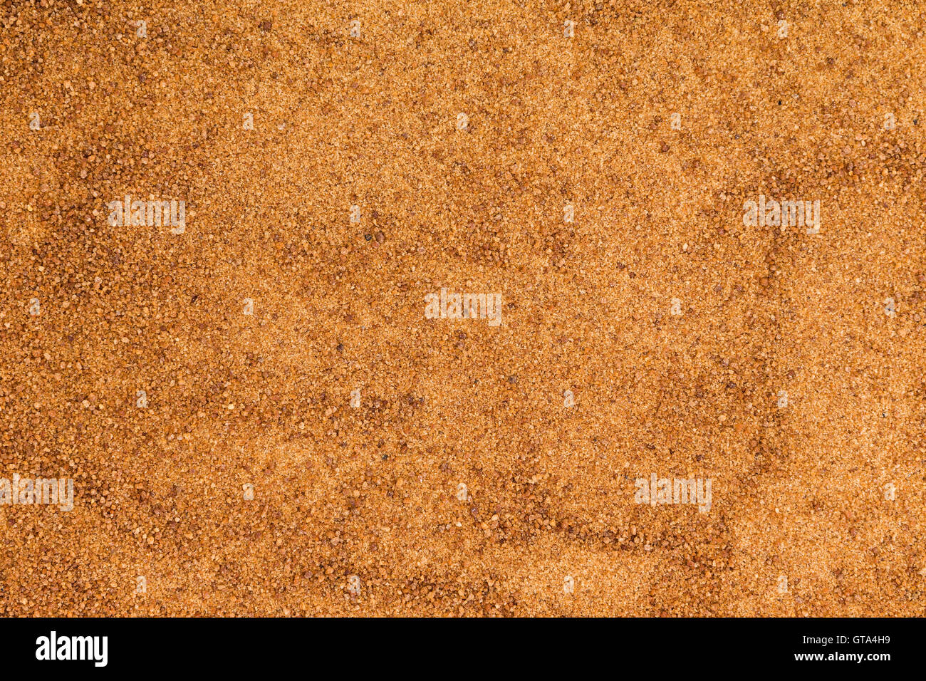 Background texture of organic coconut sugar made from the crystallized sap of cut flower buds on the coconut palm and used as a Stock Photo