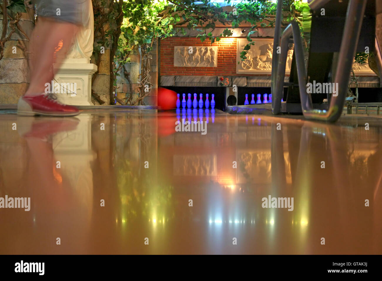 A Bowling Lane With Ball Pins And Ball Return Stock Photo