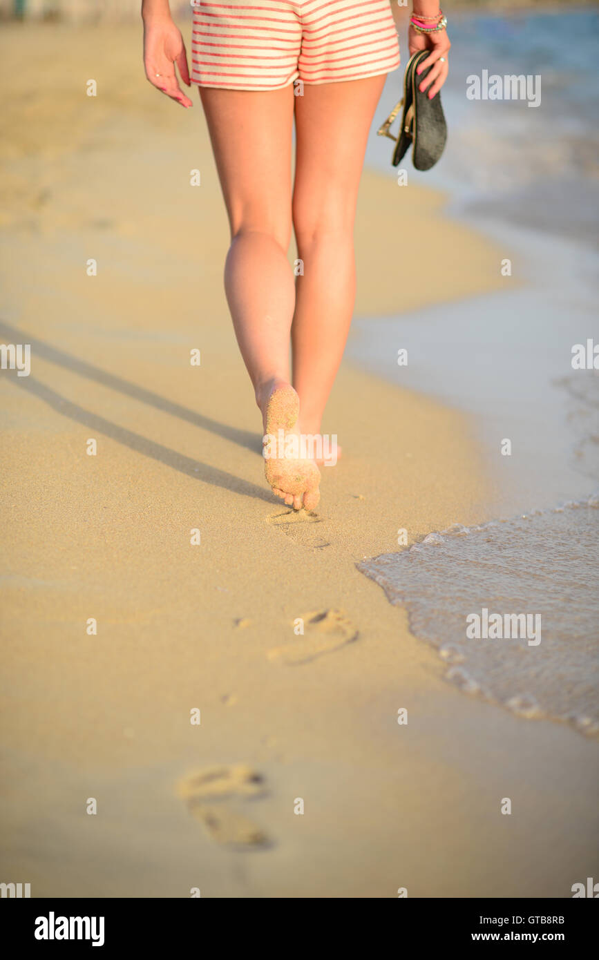 Beach Travel Woman Walking On Sand Beach Leaving Footprints In The Sand Closeup Detail Of