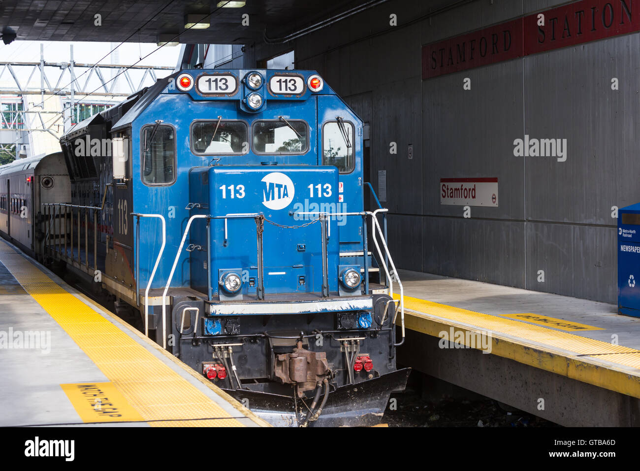 An Metro-North BL20GH diesel locomotive waits with its train in Stamford Station in Stamford, Connecticut. Stock Photo