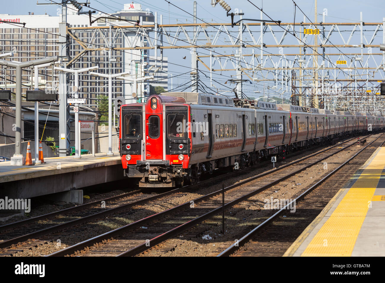 A southbound Metro-North New Haven line commuter train arrives at the station in Stamford, Connecticut. Stock Photo