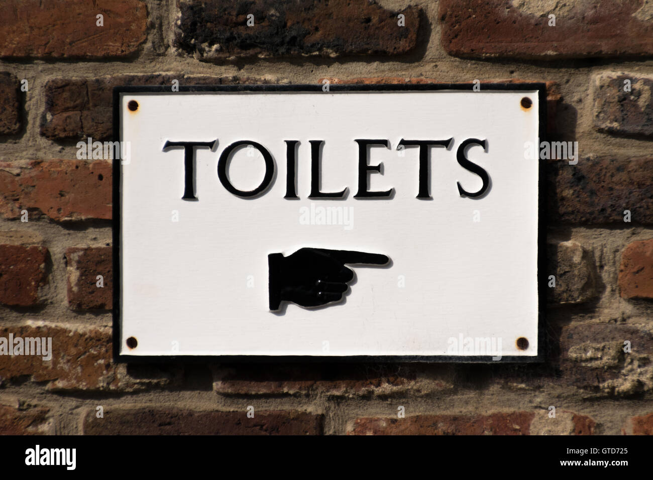 Vintage toilet sign with pointing hand Stock Photo 118304877 Alamy