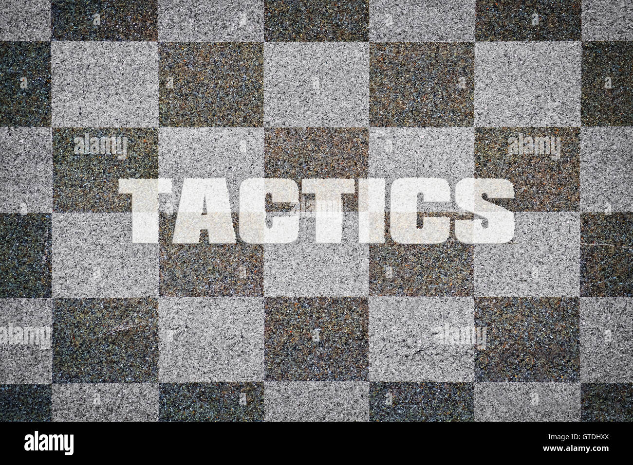 Word Tactics written on textured chessboard as background Stock Photo