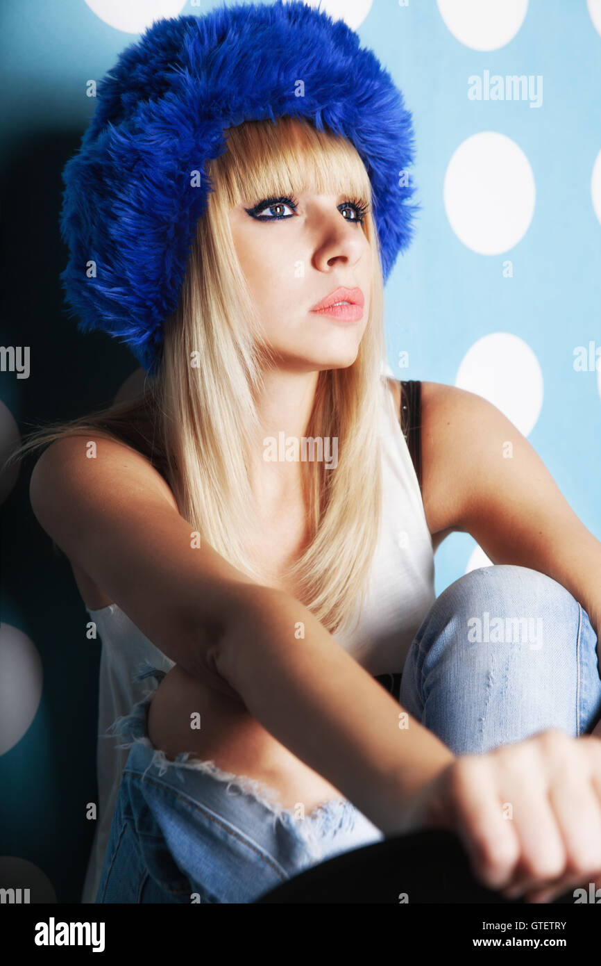 Portrait of beautiful young girl wearing blue winter hat Stock Photo