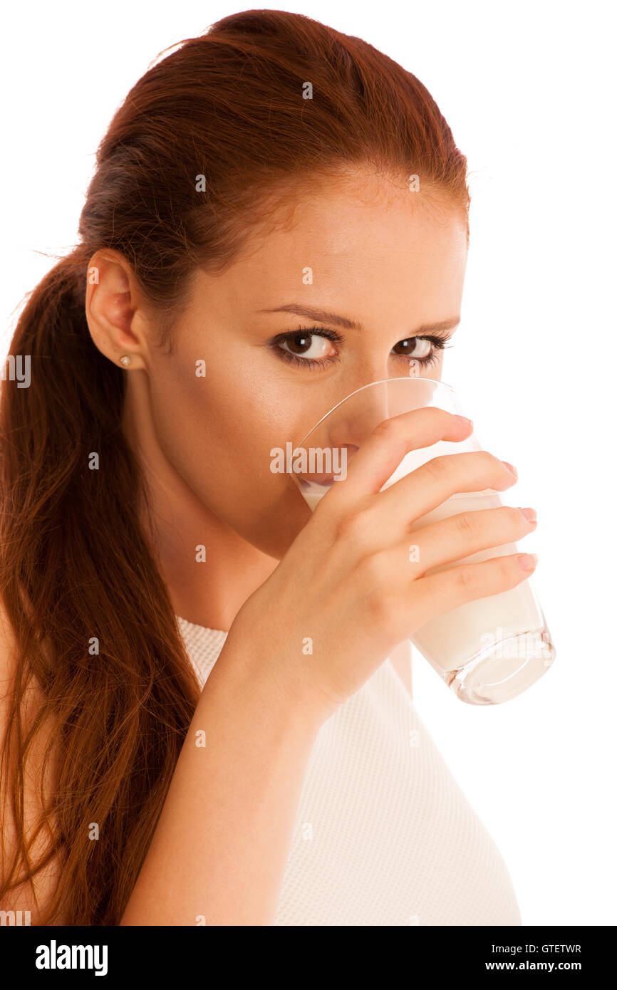 Woman drinking milk in the morning isolated over white background Stock Photo