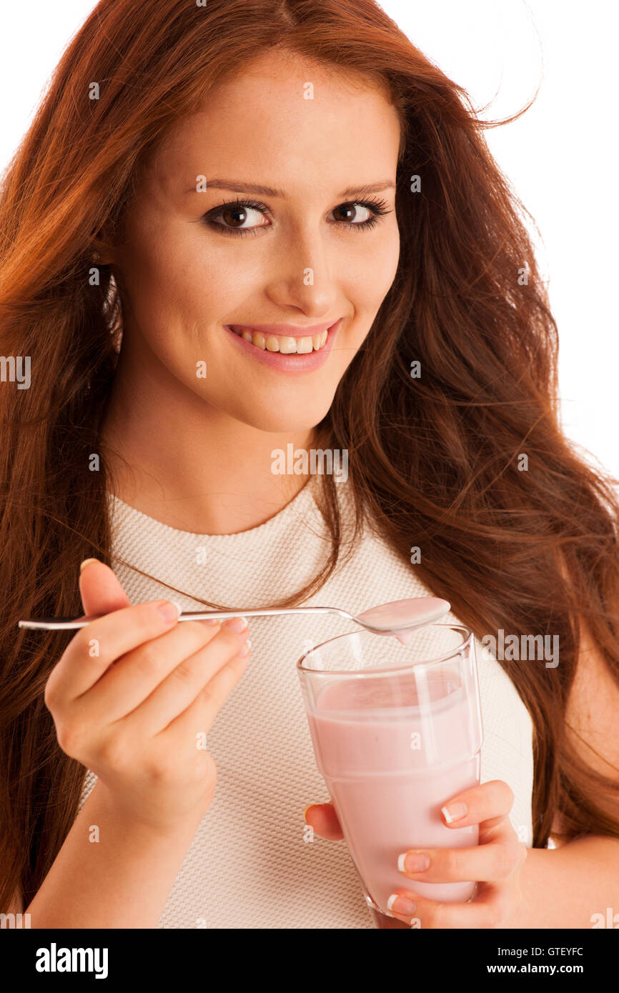 woman eating strawberry fruit yoghurt isolated over white background Stock Photo Alamy