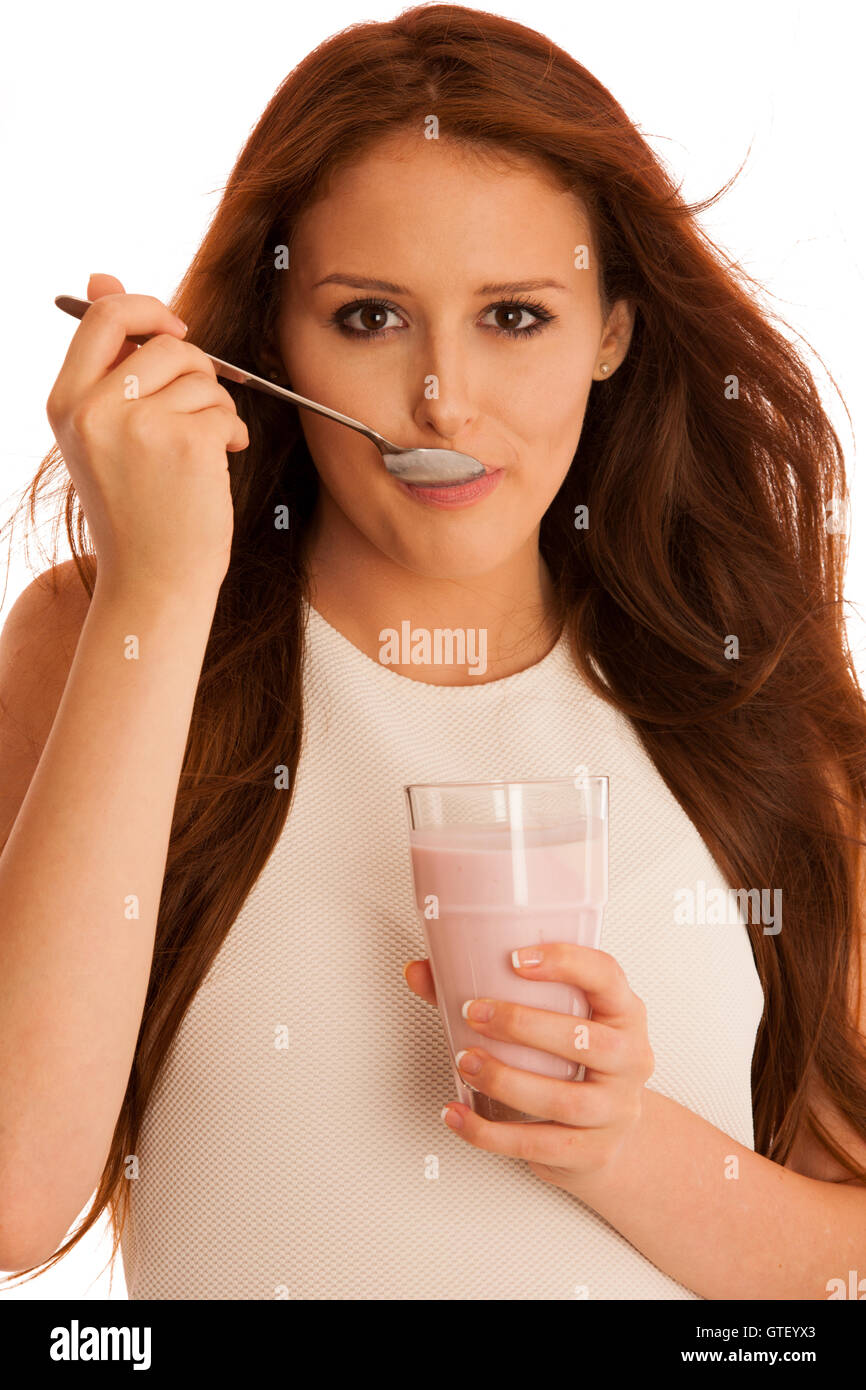woman eating strawberry fruit yoghurt isolated over white background Stock Photo Alamy