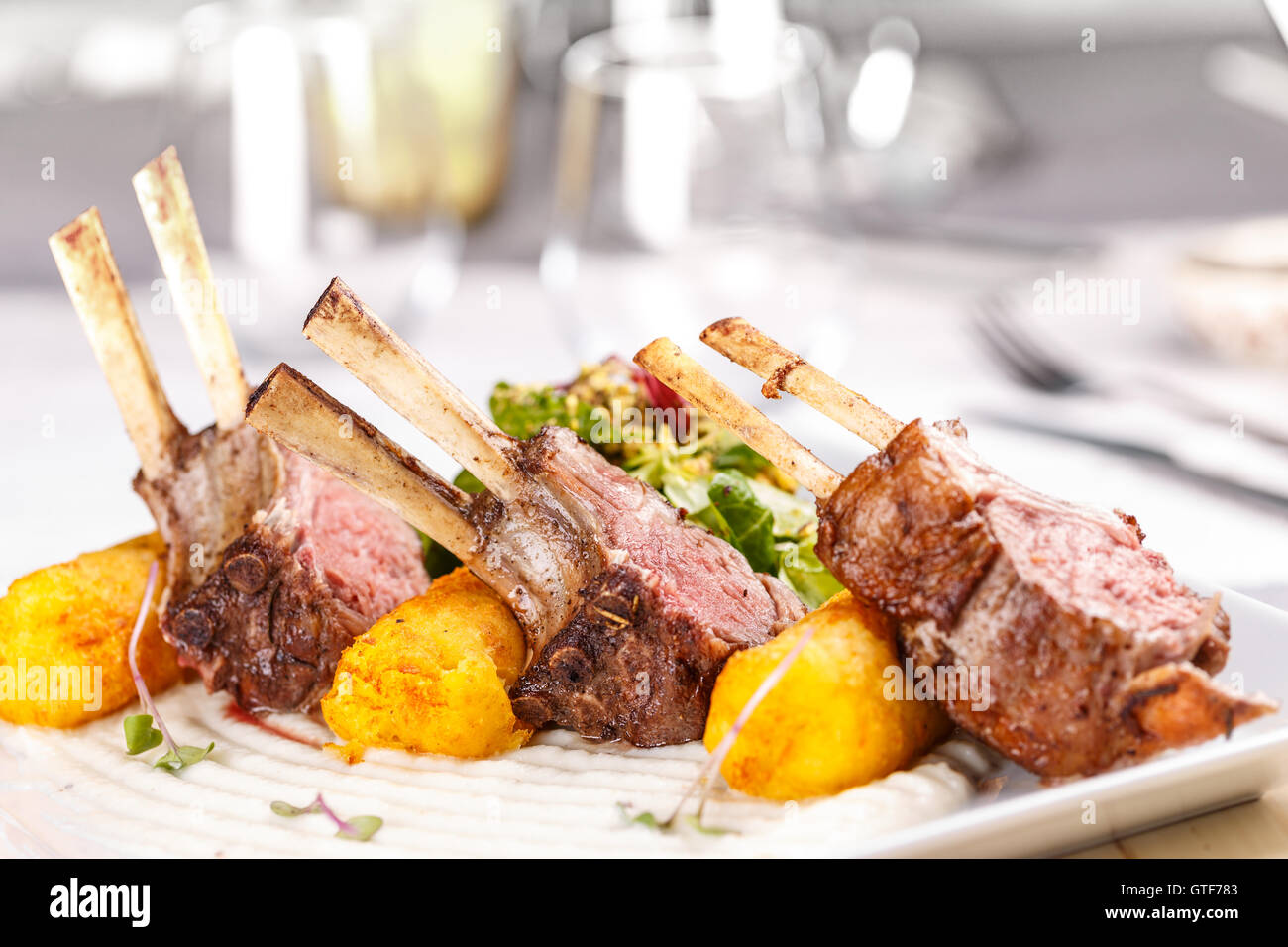 Roasted rack of lamb chops with mashed potato-filled croquettes Stock ...