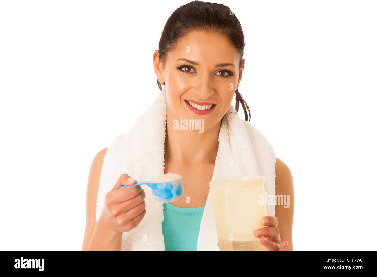 Woman preparing protein shake after fitness workout in gym isolated over white background Stock Photo