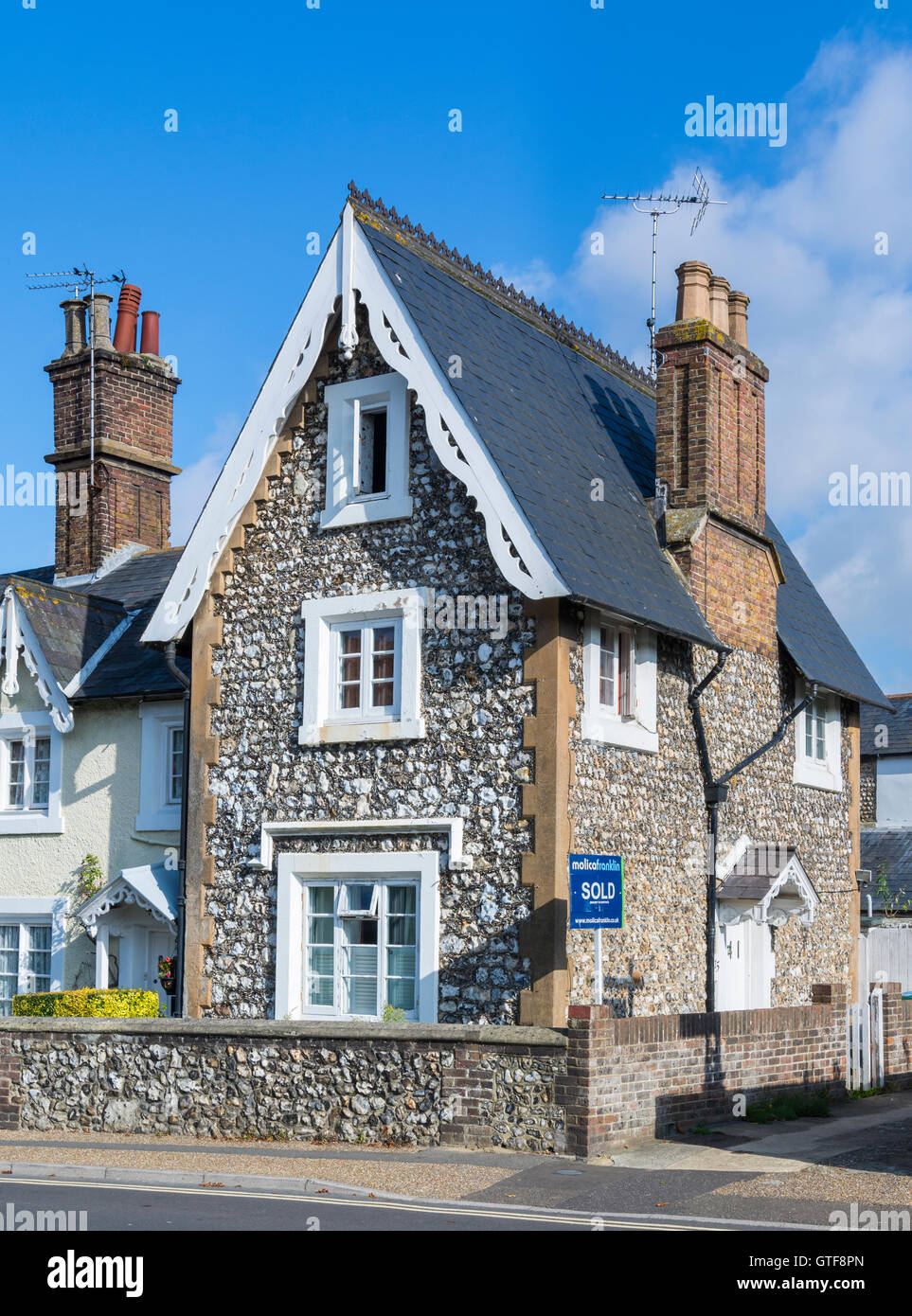 Old flint detached house in Southern UK. Stock Photo