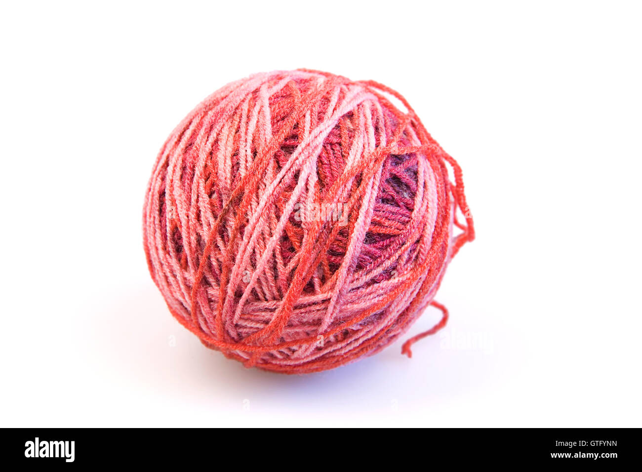 Red ball of woolen threads on a white background Stock Photo