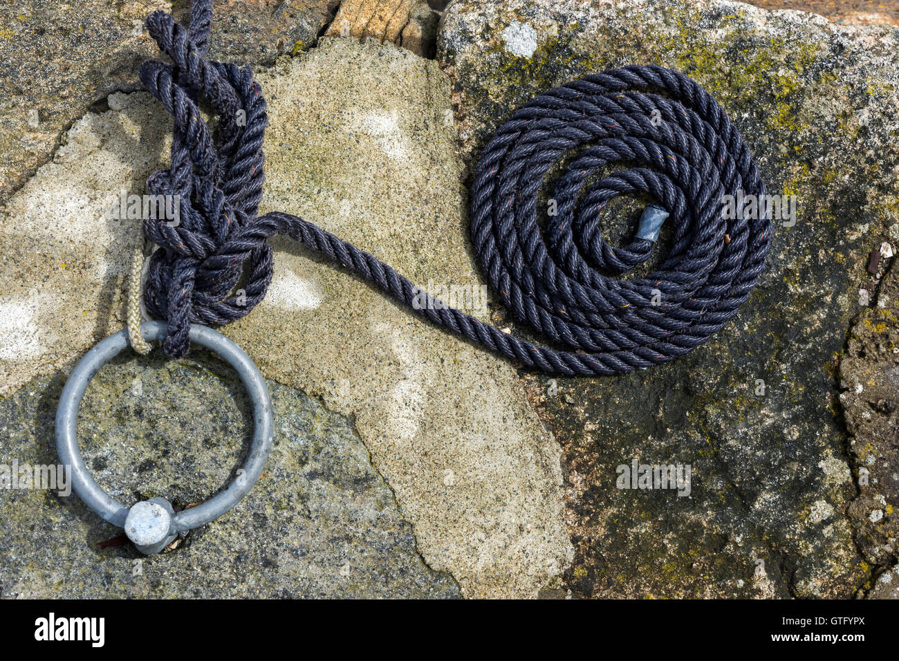 coiled rope on a jetty in Norway Stock Photo - Alamy