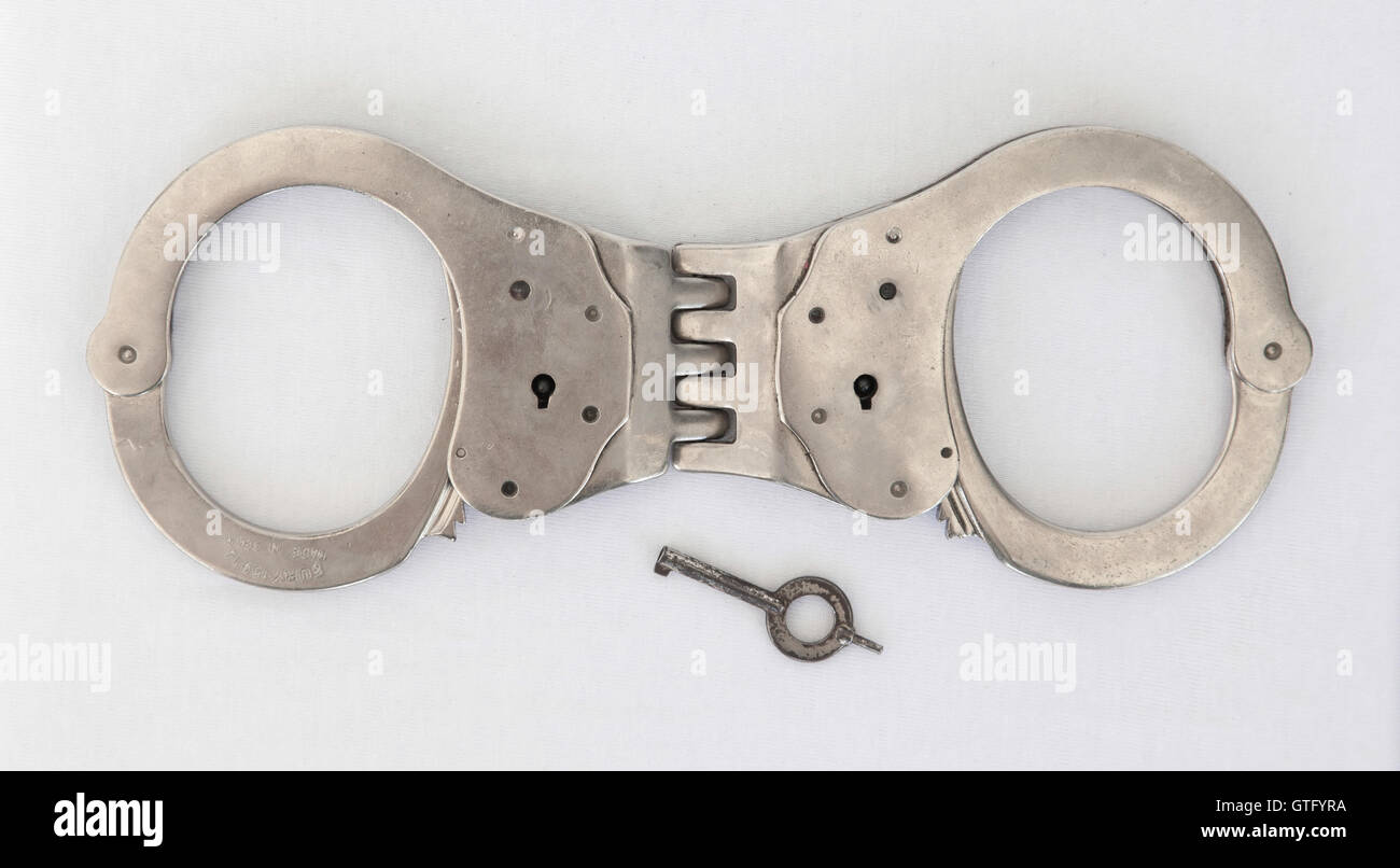 Old handcuffs and key Stock Photo Alamy