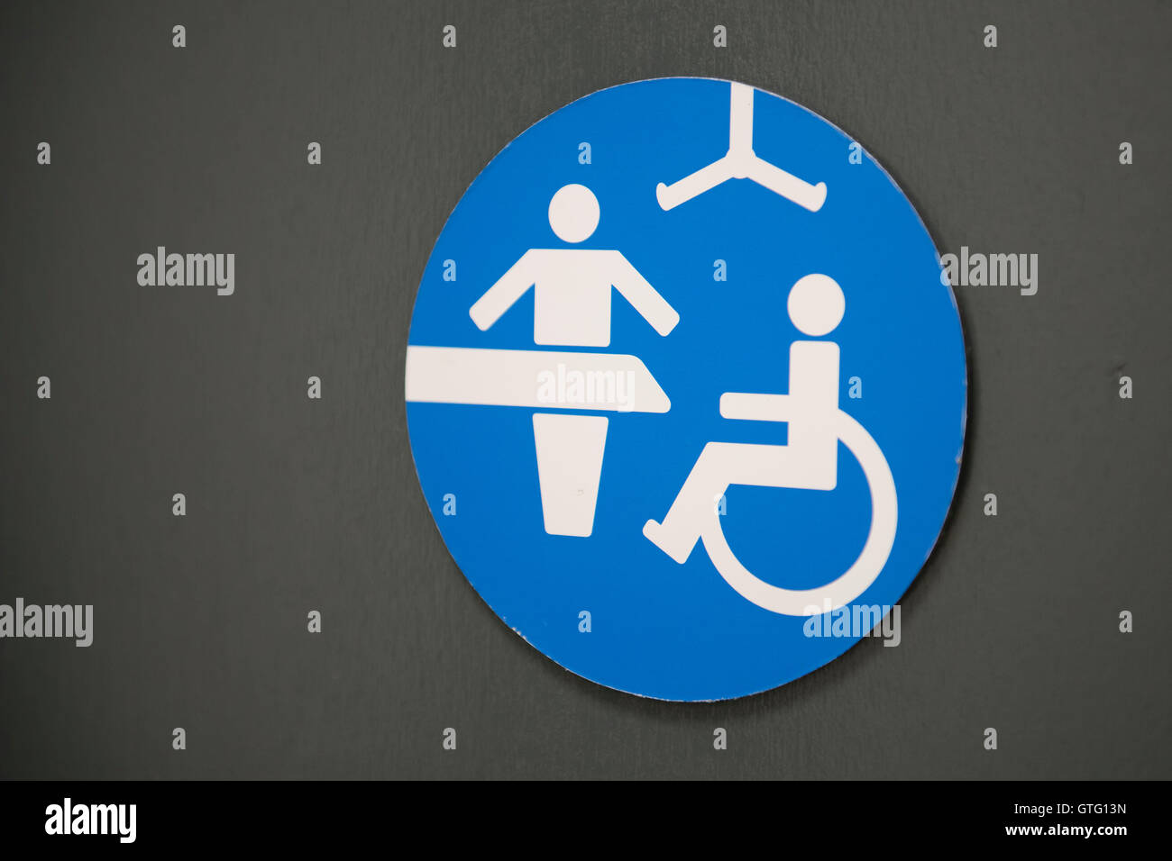 Disabled toilet and baby changing facilities in a public toilet. Stock Photo