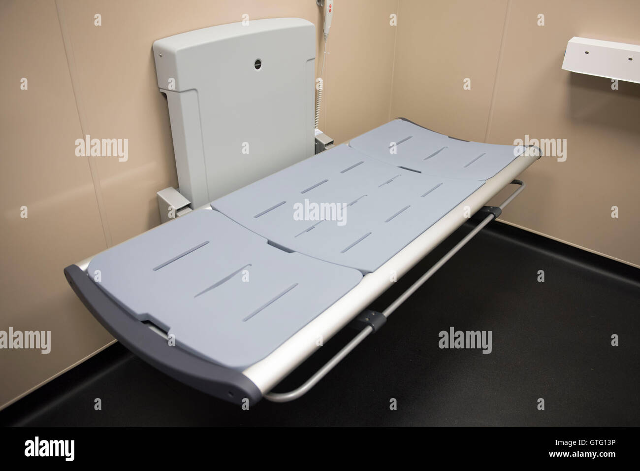 Disabled toilet and baby changing facilities in a public toilet. Stock Photo