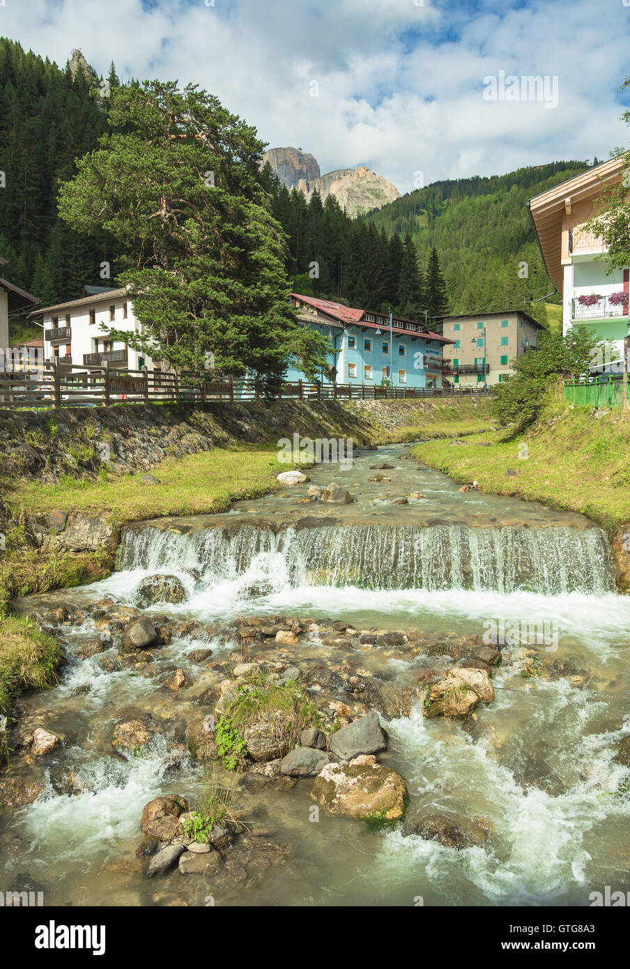 mountain river flowing through village in the Alps Stock Photo - Alamy