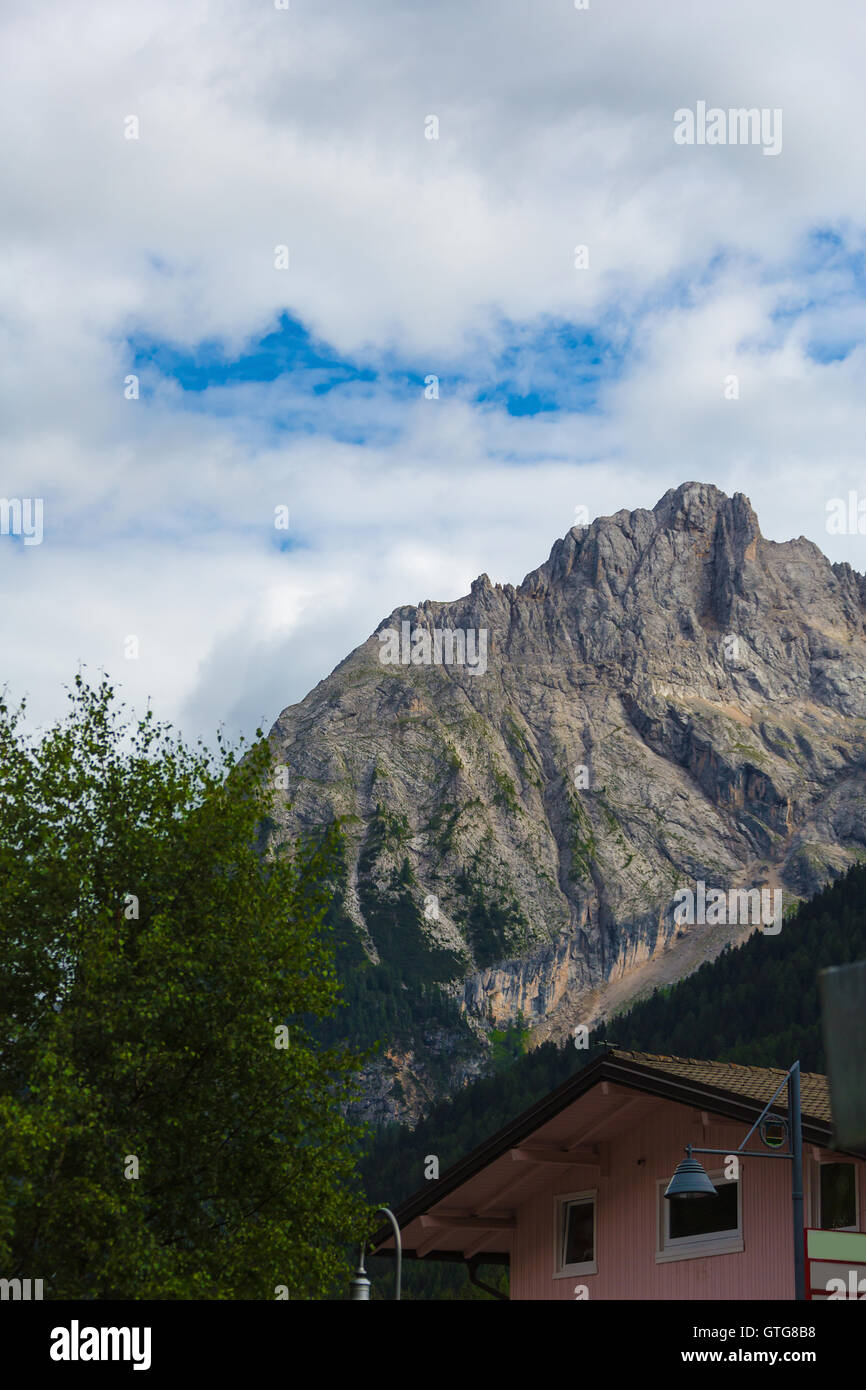 house on a background of mountains in the Alps Stock Photo - Alamy