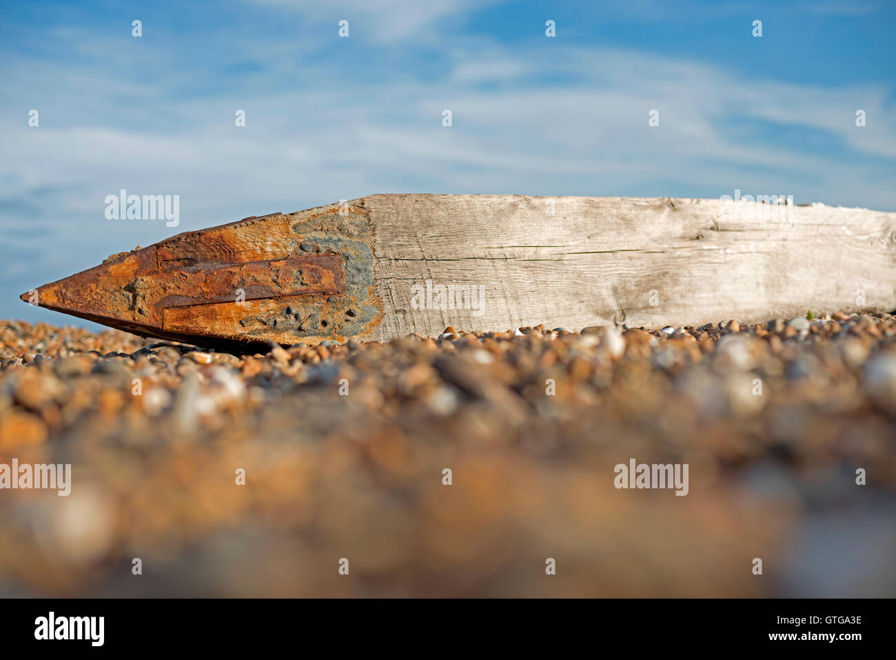 Wooden groyne (100 years old) laying on beach due to coastal erosion Bawdsey Ferry Suffolk UK Stock Photo
