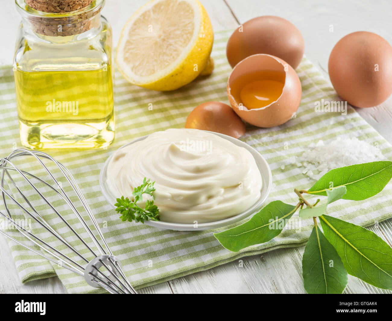 Natural mayonnaise ingredients and the sauce itself. Stock Photo
