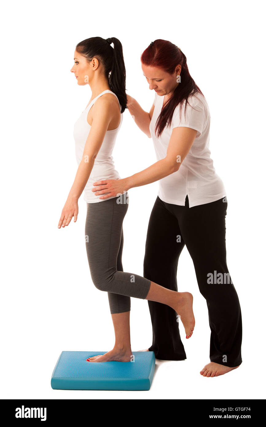 Physiotherapy - therapist doing   excercises for improving coordination and stability with a patient to recover  after injury Stock Photo
