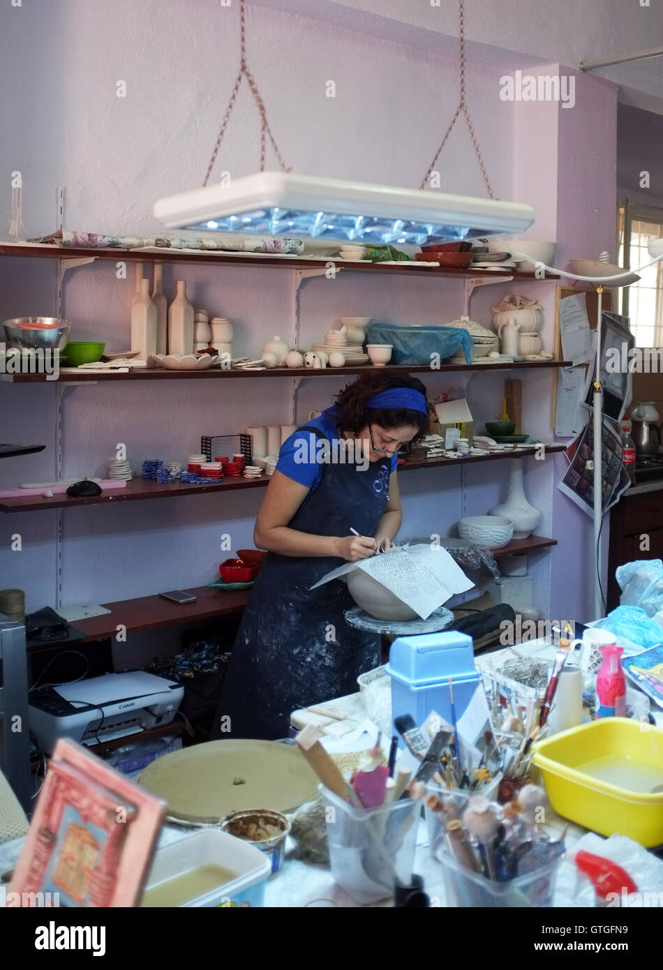 Ceramic artist working in her studio Stock Photo - Alamy